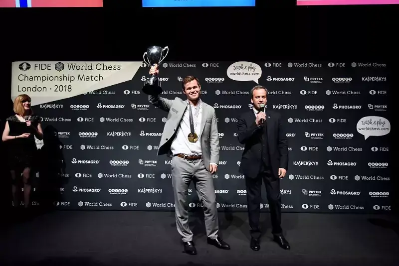 Chess master and winner, Magnus Carlsen (L) and FIDE President, Arkady Dvorkovich at the award ceremony of the World Chess Championship 2018 on November 28, London