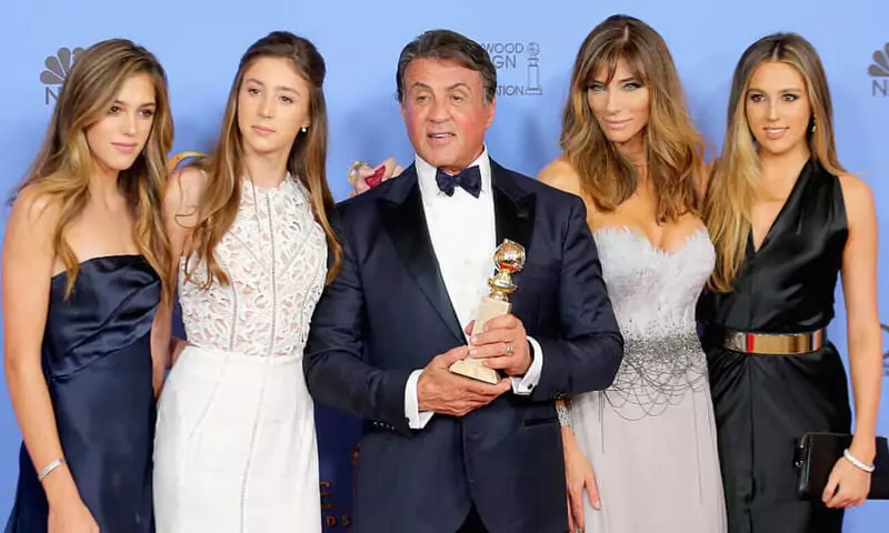Sylvester Stallone received trophy beside his daughters.