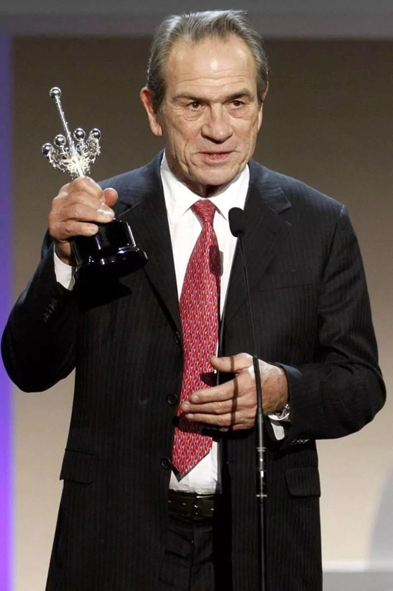 Tommy Lee Jones Holding A Trophy